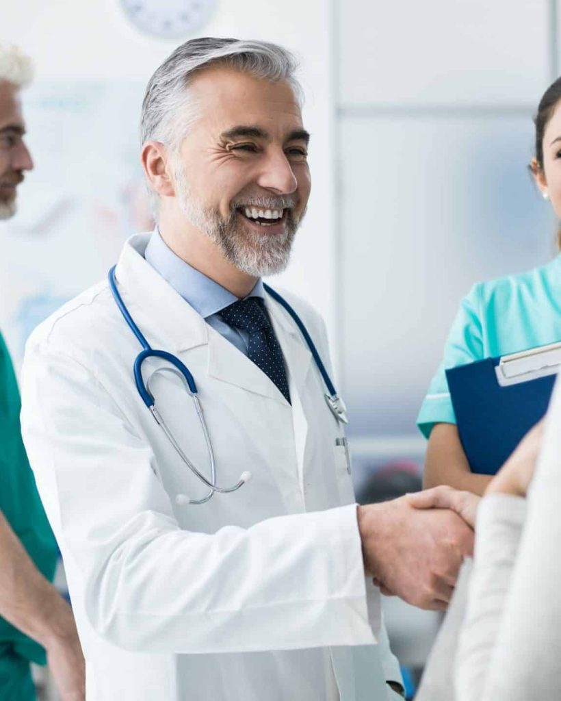confident-doctor-shaking-patient-s-hand-e1623252367541.jpg
